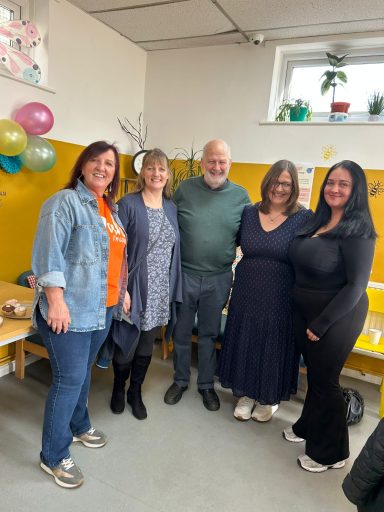 Family with worker Shelley after the award